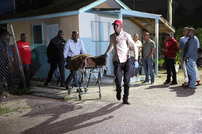 THE BODY of a man that was fatally shot last night is removed from the crime scene.
Photo: Dante Carrer