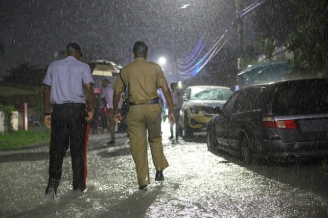 Police at the scene of the shooting in Nassau Village. Photo: Dante Carrer