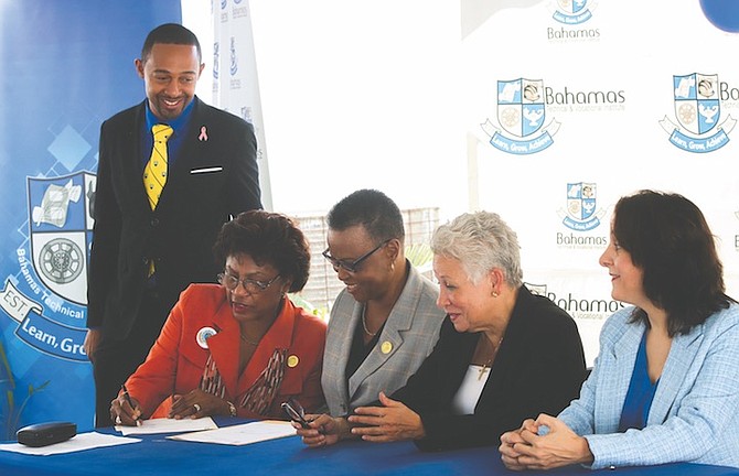 THE SIGNING ceremony yesterday at BTVI in an agreement to provide uniforms for staff at Breezes. After the signing, a tour was held of the rooms where the uniforms will be made. Photos: BTVI