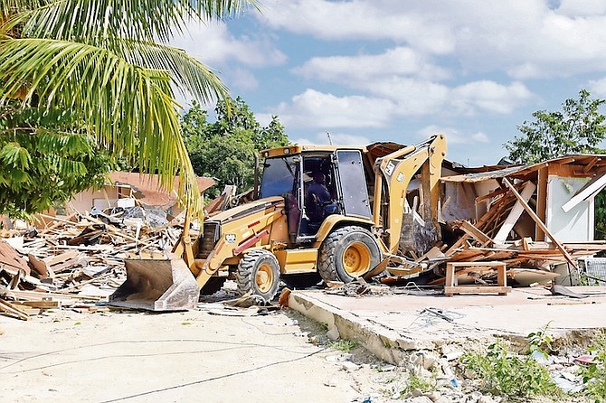 AFTER Police and Defence Force officers ensured homes were unoccupied bulldozers demolished structures at All Saints shanty town.
Photos: Ministry of Works