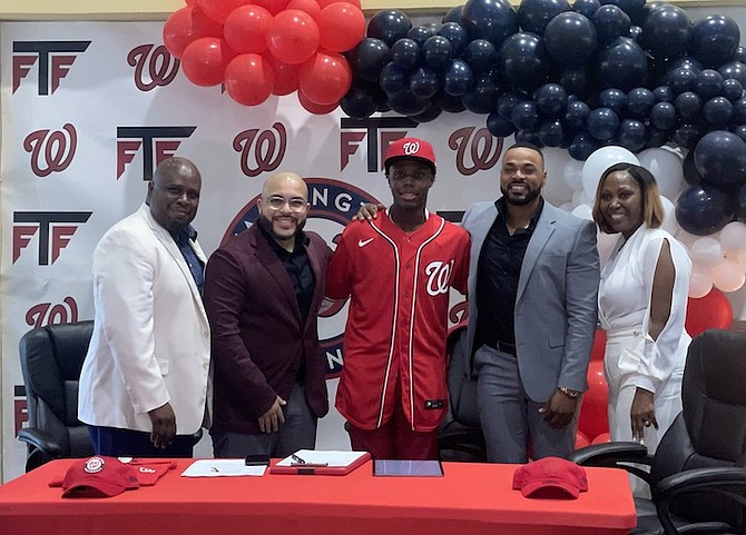 MAKING IT OFFICIAL: Rohan Culmer officially signed with the Washington Nationals at the Andre Rodgers National Baseball Stadium on Saturday.
Photo: Tenajh Sweeting/Tribune Staff