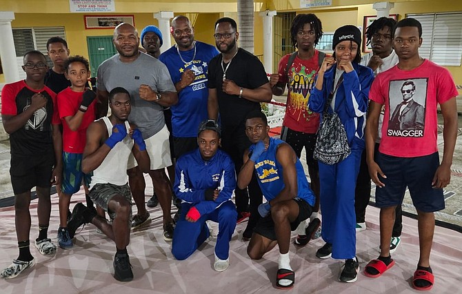 SHERMAN ‘the Tank’ Williams and ‘Pretty Boy’ Floyd Seymour pose with some of the competitors in the amateur boxing show in Grand Bahama.