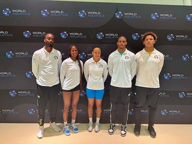 TEAM Bahamas continues competition at the World Aquatics Championships in Doha, Qatar. BahamIan swimmers Victoria Russell, Rhaniskha Gibbs, Lamar Taylor and Marvin Johnson (above) with their coach Camron Bruney.