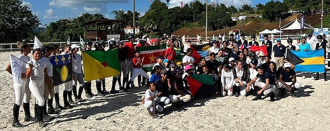 BRINGING THE CARIBBEAN TOGETHER: Eight nations competed in the Martinique leg of the Grand Caraibe Tour. Back row, from left to right, riders from Guadeloupe, French Guyana, Suriname,
Jamaica, Antigua and Barbuda, Bermuda and The Bahamas. Front Row: Riders from Martinique.