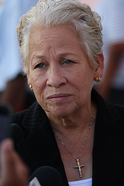 Minister of Education and Technical and Vocational Training Glenys Hanna-Martin speaks to reporters outside the House of Assembly on May 1, 2024. Photo: Dante Carrer