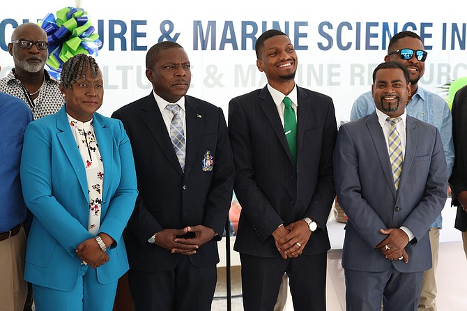 From left are BAMSI President Dr Raveena Roberts-Hanna, Minister of Agriculture and Marine Resources Jomo Campbell, Eeden Farms Co-Founders Lincoln Deal and Gil Cassar pose for a photo with other officials during the official handover of two container farms from Eeden Farms to BAMSI on May 6, 2024. Dante Carrer