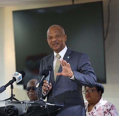 Minister of Social Services, Information and Broadcasting Myles LaRoda speaks during the opening ceremony of the International Day of Families Forum at The National Training Agency yesterday. 
Photo: Dante Carrer/Tribune Staff