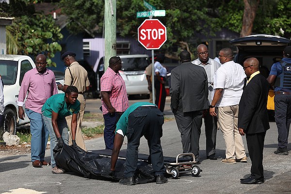 The scene on Augusta St near Ferguson St where two men were shot. One of the men was transported to hospital while the other died at the scene. Photo: Dante Carrer/Tribune Staff