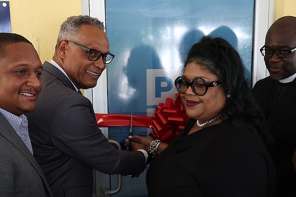 Minister of Health and Wellness Dr. Michael Darville and Public Hospitals Authority (PHA) Managing Director Dr Aubynette Rolle cut the ribbon during a ceremony to commission the new location of the Princess Margaret Hospital Blood Bank at First Terrace on May 21, 2024. Photo: Dante Carrer/Tribune Staff