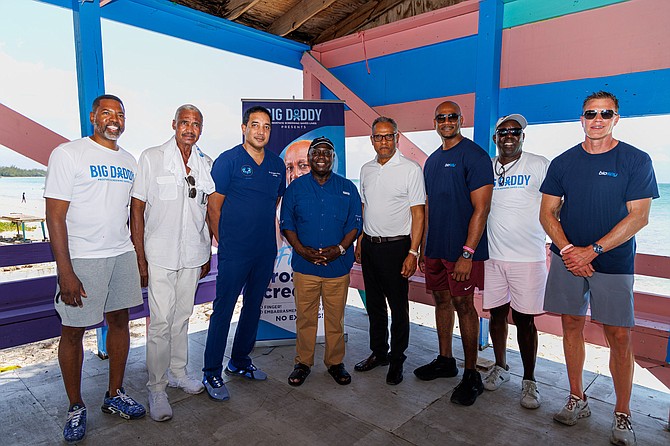 BIG DADDY LAUNCH (left to right) Warren Davis, event organizer; Leslie Miller, former MP and prostate cancer survivor; Dr. Greggory Pinto, Urologist; Prime Minister Philip Davis; Minister of Health and Wellness Dr. Michael Darville; Dr. Alfred Dawes; Vincent McDonald, event host; and Charlie Balentine, Managing Partner, Biospy.