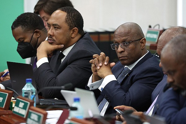 Free National Movement deputy leader Shanendon Cartwright and Opposition Leader Michael Pintard look on as Prime Minister Philip "Brave" Davis gives his 2024 Budget Communication speech in the House of Assembly on May 29, 2024. Photo: Dante Carrer/Tribune Staff