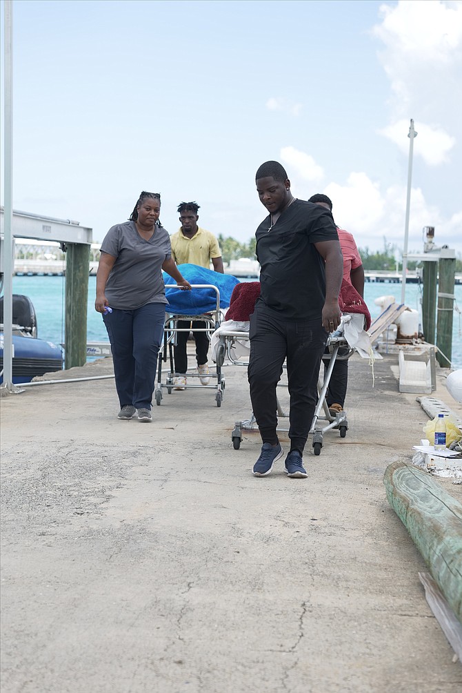 Bodies being taken away after the death of two men in a boating incident.
Photo: Nikia Charlton