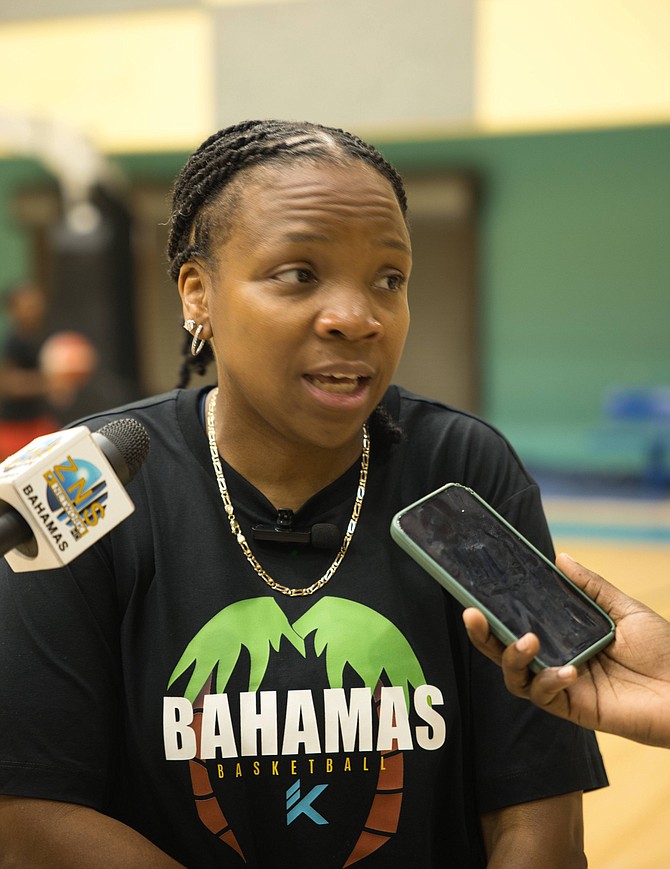 COACH Yolett McPhee-McCuin speaks with reporters as she hosted the senior women’s national basketball team training camp at Kendal GL Isaacs Gymnasium last night. Photo by Chappell Whyms Jr