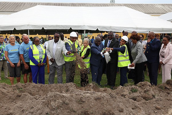 Let’s Swim Bahamas Founders Nancy and Andy Knowles, Fox Foundation Founder Dr Adrian Fox, Minister of Education and Technical and Vocational Training Glenys Hanna-Martin, Prime Minister Philip "Brave" Davis, Minister of Youth, Sports and Culture Mario Bowleg, Fox Foundation Co-Founder Adriana Fox and other officials during the groundbreaking ceremony of the first public high school swimming pool at GHS on June 13, 2024. Photo: Dante Carrer/Tribune Staff