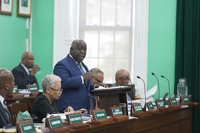 PM Davis speaking during budget debate yesterday. Photos: Nikia Charlton