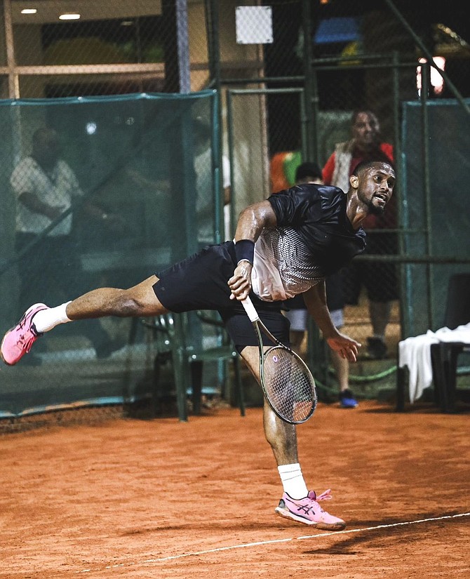 Justin Roberts returns a volley.