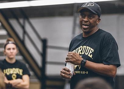Boilermaker coach Norbert Elliott speaking to his athletes at Purdue University.