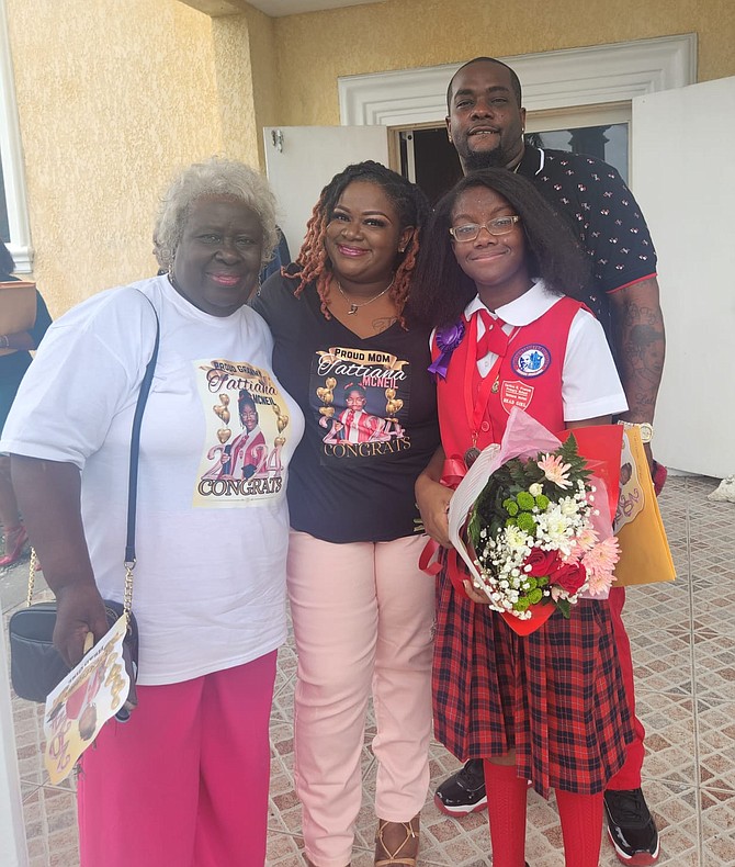 TATTIANA McNeil pictured with her mother and grandmother at her graduation from Carleton E Francis Primary School.