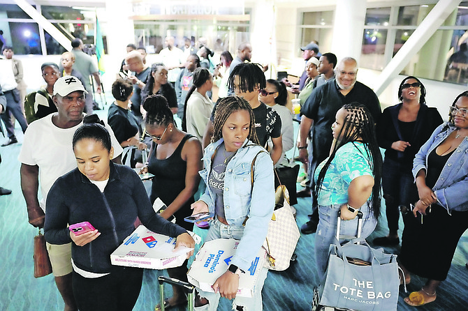 Passengers including thirty students arrived at Lynden Pindling International Airport on Tuesday after being evacuated from the path of Hurricane Beryl. Photo: Dante Carrer/Tribune Staff