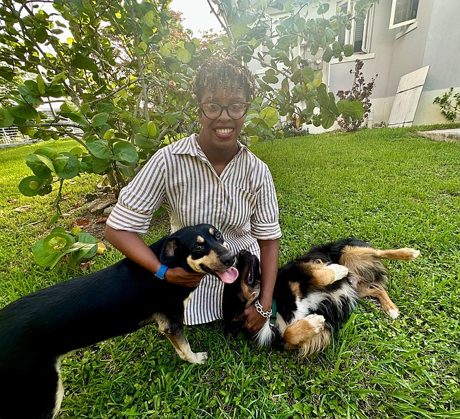 Senator Michela Barnett-Ellis with her dogs Storm and Max