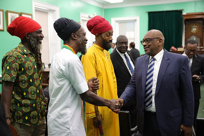 Dr Hubert Minnis greeting members of the Rastafarian community at the House of Assembly. Photo: Dante Carrer/Tribune Staff