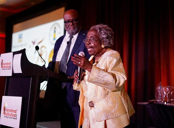 Dr Enid Pinkney at age 91 at the 2023 Bahamas Diaspora Awards at the Miami Marriott Biscayne Bay, with Dr Andy Ingraham looking on.