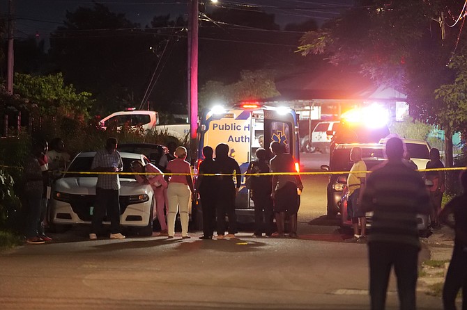 The scene in Eden Street last night after a man was shot and killed in the 74th murder of the year.  Photos: Nikia Charlton