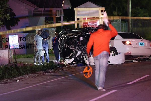 The scene of last night’s fatal crash at the entrance to Mount Pleasant Village last night in which a man was killed. It was one of two traffic fatalities over the weekend, following another crash on West Bay Street at 2am on Friday.  Photo: Dante Carrer/Tribune Staff