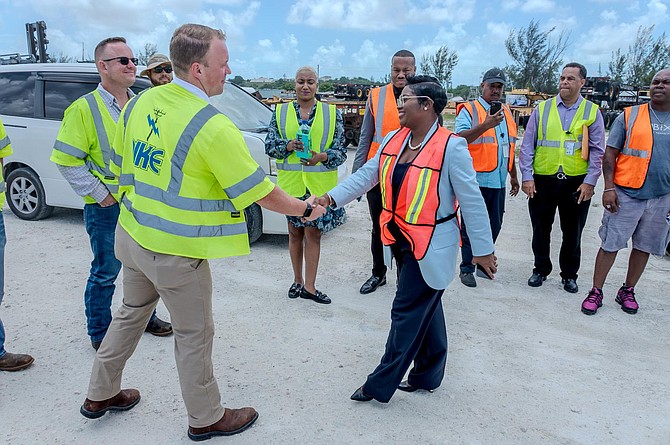 Minister of Energy and Transport JoBeth Coleby-Davis inspected Pike Corporation (Island Grid) bucket trucks on Tuesday.  Photo:::: Anthon Thompson/BIS