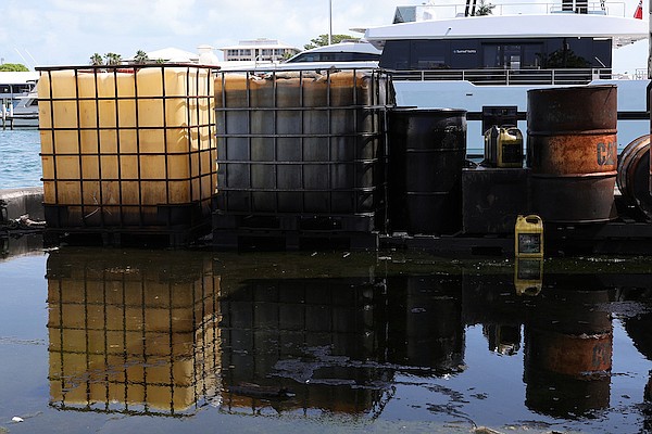 Workers at Potter’s Cay Dock expressed concerns over several sunken vessels that they believe are contaminating waters there. Photos: Dante Carrer/Tribune Staff