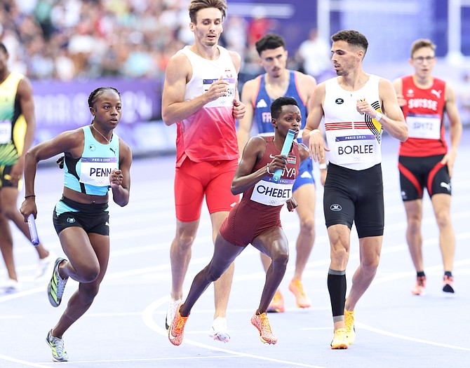 Quincy Penn taking off on the final leg of the mixed 4x400m relay.