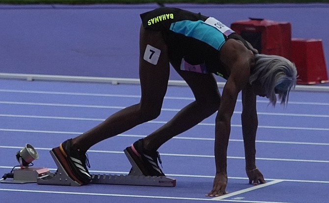 Shaunae Miller-Uibo in set position at the Paris Olympics.