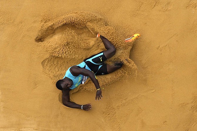 KEN MULLINGS, of The Bahamas, competes in the decathlon long jump at the Summer Olympics, August 2 in Saint-Denis, France. (AP Photo/David J. Phillip)