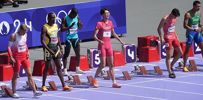 Antoine Andrews, third from left, at the start of the men’s 110m hurdles.