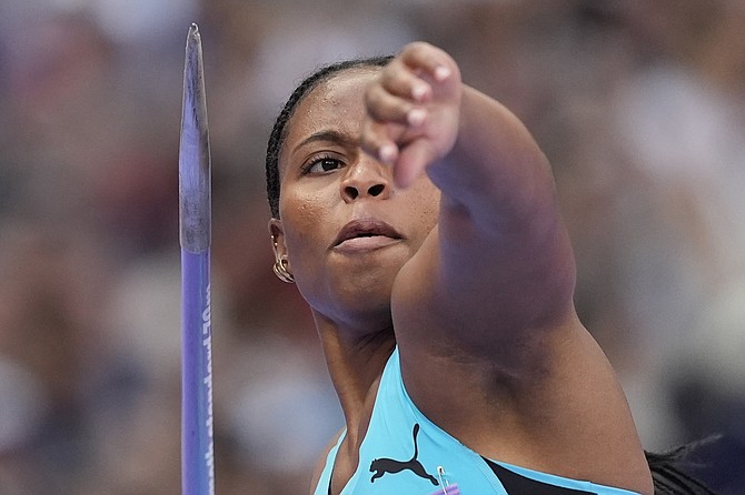 Rhema Otabor, of Bahamas, competes during the women's javelin throw qualification at the 2024 Summer Olympics, Wednesday, Aug. 7, 2024, in Saint-Denis, France. (AP Photo/Matthias Schrader)