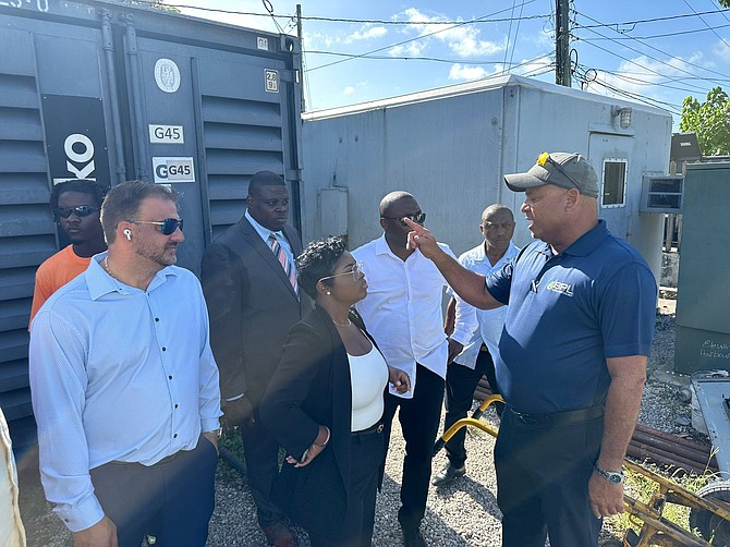 Energy and Transport minister JoBeth Coleby-Davis speaks with BPL officials during a visit to Harbour Island on August 12, 2024.