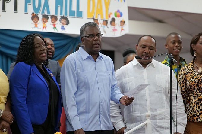 MeMberS of Parliament, Fred Mitchell and Shenondon Cartwright, join in a song selection at Mount Carey Baptist Church during the Fox Hill Day Church service. Photo: Nikia Charlton