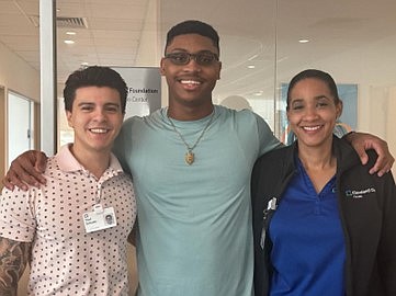 BAHAMIAN track star Kristofer Wong (centre) with his Cleveland Clinic Florida physical therapists Paul Zumaeta and Shari Gordon in Weston, Florida.