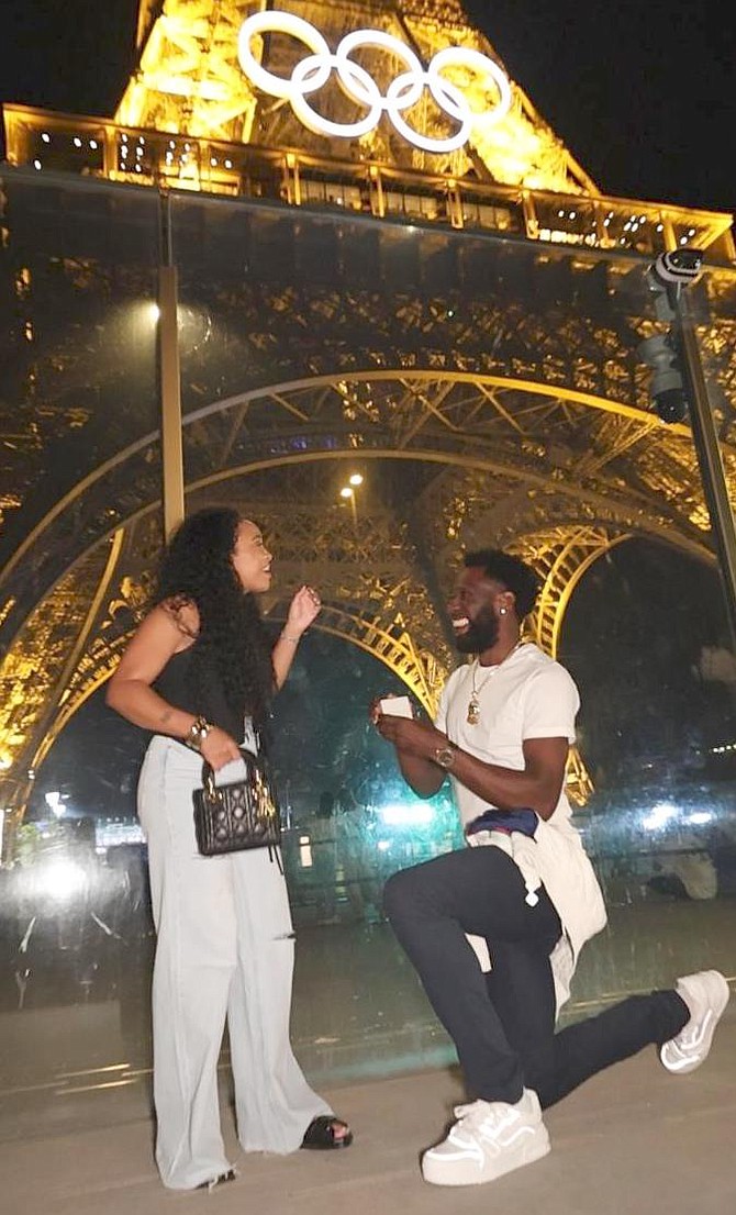 DONALD Thomas proposes to his fiancée Rayven in front of the Eiffel Tower in Paris, France. Photo by Brent Stubbs