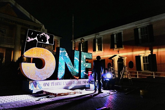 Production crew work to erect a stage ahead of Goombay on Bay in Parliament Square during a blackout on August 15, 2024. Photo: Dante Carrer/Tribune Staff