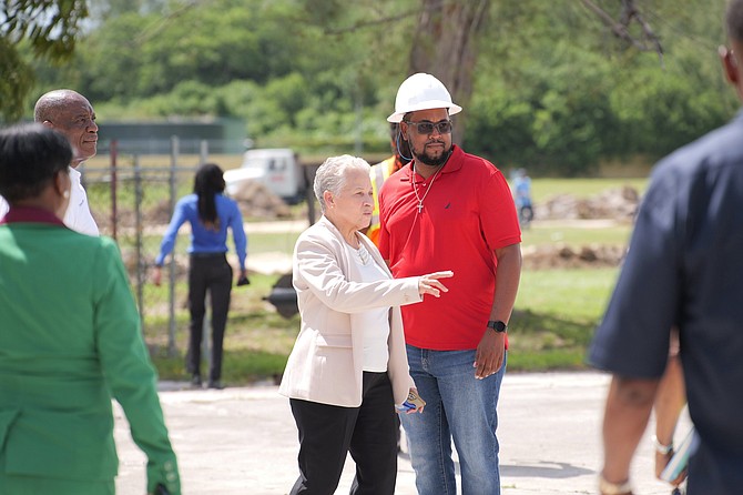 Hanna Martin inspects the repair progress of the school