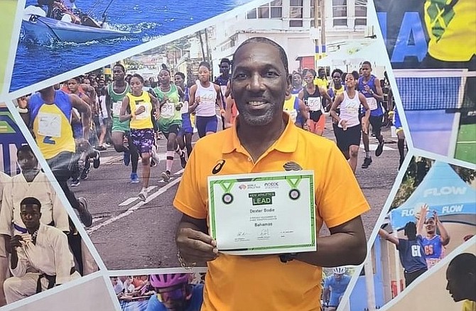 Coach Dexter Bodie holds his certification he earned in St Vincent and the Grenadines.