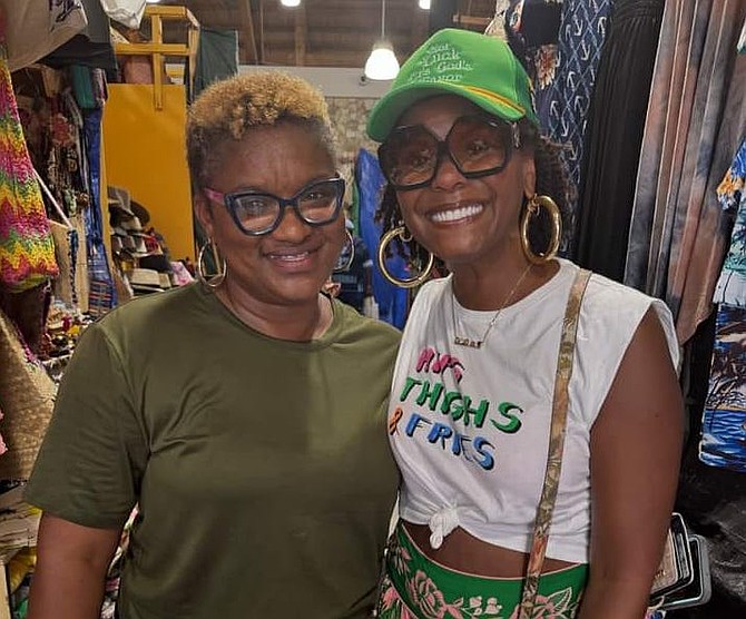 Charmaine Hepburn-Thompson (left) and Tabitha Brown (right) share a surreal moment in the world famous Nassau Straw Market that changed their lives.