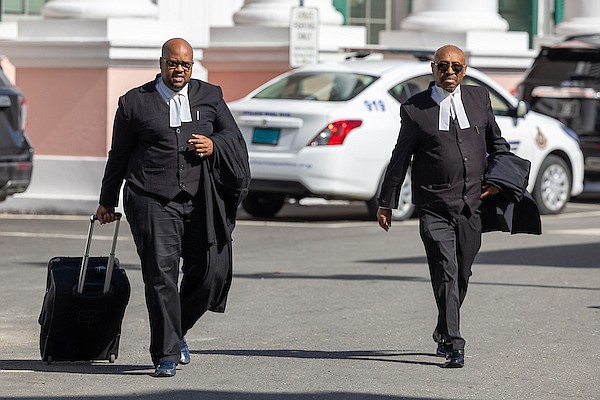 Murrio Ducille KC and Brian Bastian, legal council for Adrian Gibson, outside court on August 26, 2024. Photo: Dante Carrer/Tribune Staff