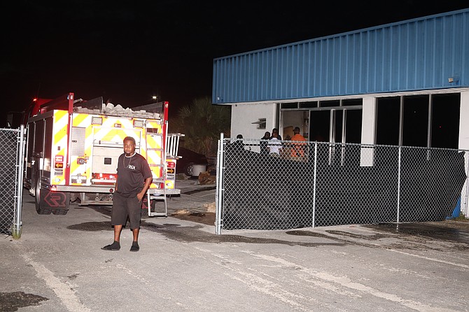 Fire personnel on the scene at a commercial building that suffered an estimated $75,000 in damages from a fire caused by an electrical issue. Photo: Vandyke Hepburn