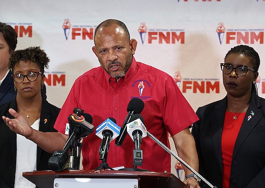 Free National Movement (FNM) Chairman Dr Dwayne Sands, flanked by Senator Michela Barnett-Ellis and Maxine Seymour, speaks during a press conference at FNM Headquarters on Sept 2, 2024. Photo: Dante Carrer/Tribune Staff