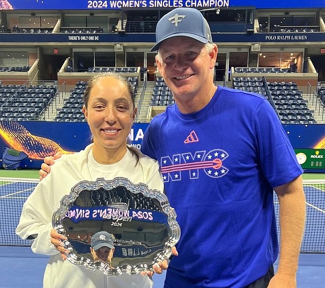 Bahamian US Open doubles champion Mark Knowles shares a moment with American US Open singles runners-up Jessica Pegula, whom he’s now coaching.