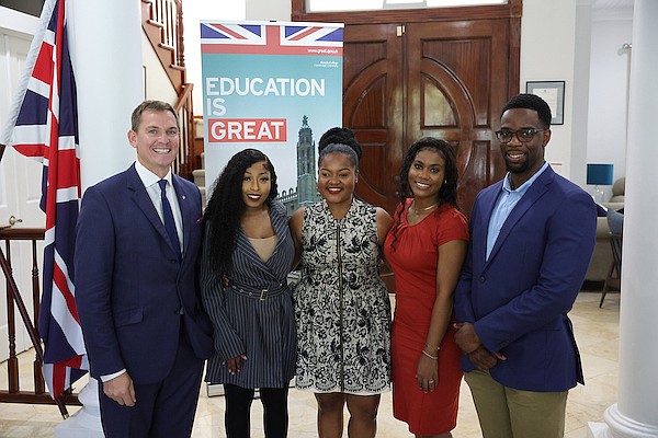 British High Commissioner Tom Hartley poses with Chevening candidates Denisha Mortimer, Dr Lauren Brown, Gabriel Sullivan and Malachi Reckley during an afternoon tea hosted by The British High Commission at the Commission Residence. Photo: Dante Carrer/Tribune Staff