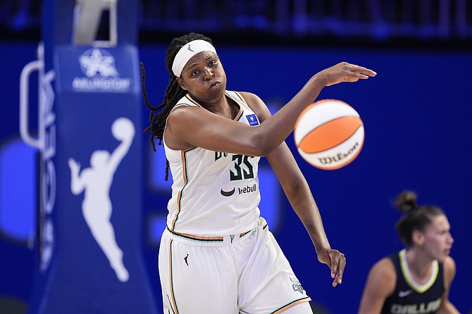 New York Liberty forward Jonquel Jones makes a pass against the Dallas Wings in a WNBA basketball game on Thursday. (AP Photo/Tony Gutierrez)