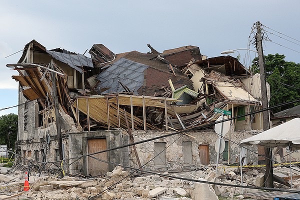 The historic Reinhard Hotel collapsed on September 16, 2024, blocking Baillou Hill Road with debris and damaging a neighbouring home. Photo Dante Carrer/Tribune Staff